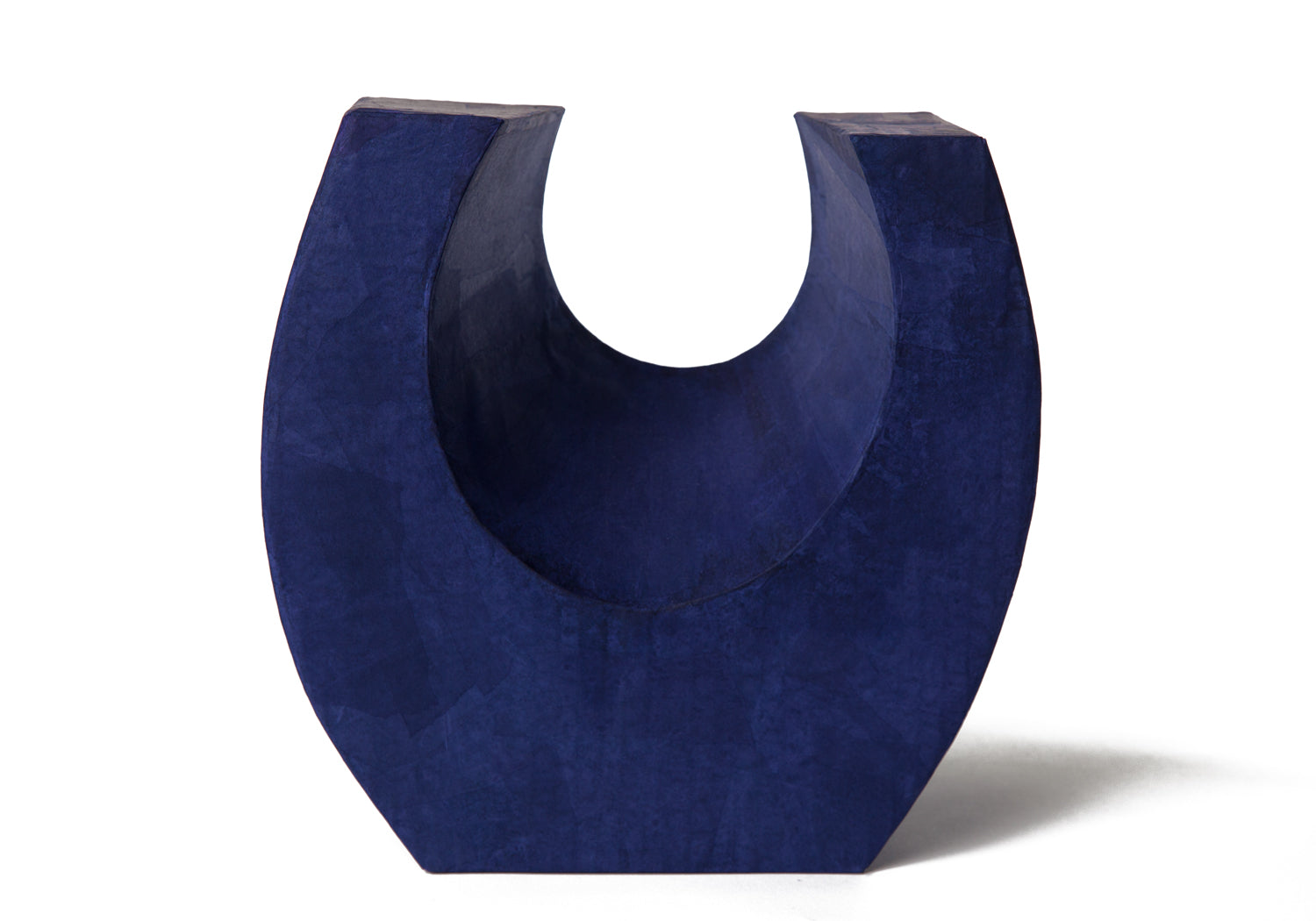 Picture of a beautiful purple horseshoe shaped biodegradable paper cremation urn on sale at Muses Design Urns. Front view.
