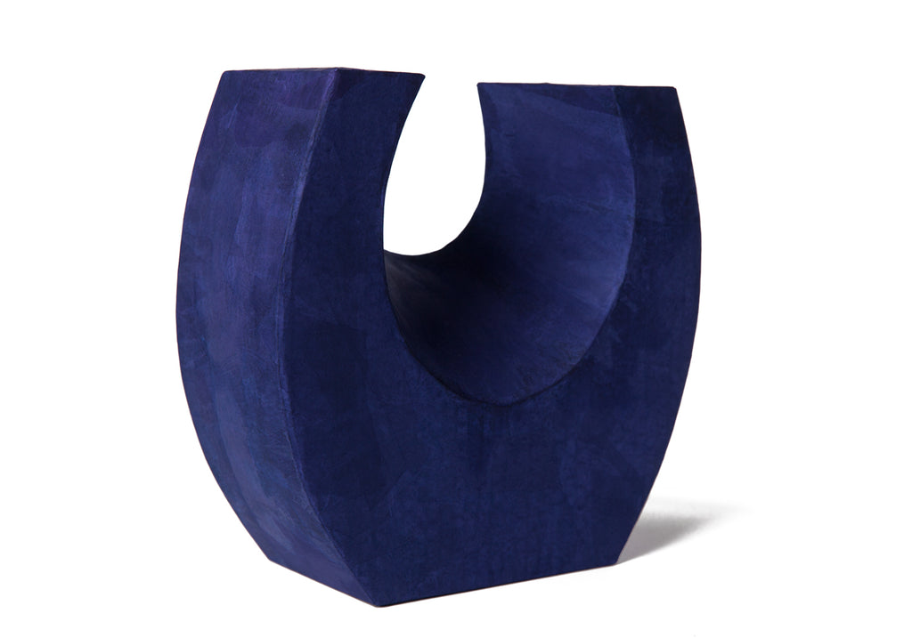 Picture of a beautiful purple horseshoe shaped biodegradable paper cremation urn on sale at Muses Design Urns. Right side view.